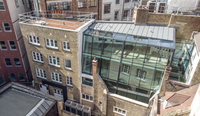 Office refurbishment in Central London creates a glass two-storey extension to connect two buildings
