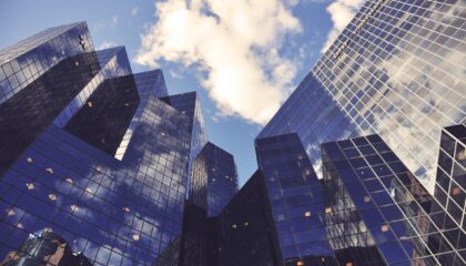 glass offices against blue sky