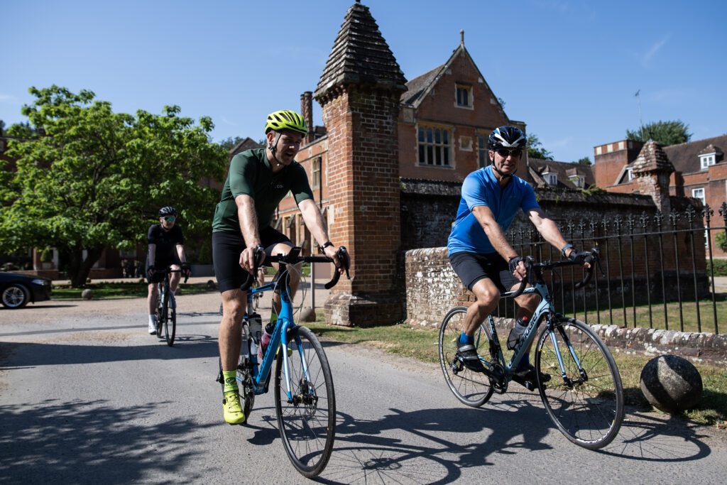 Workman cycling with client